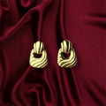 Pendientes de oro y arena